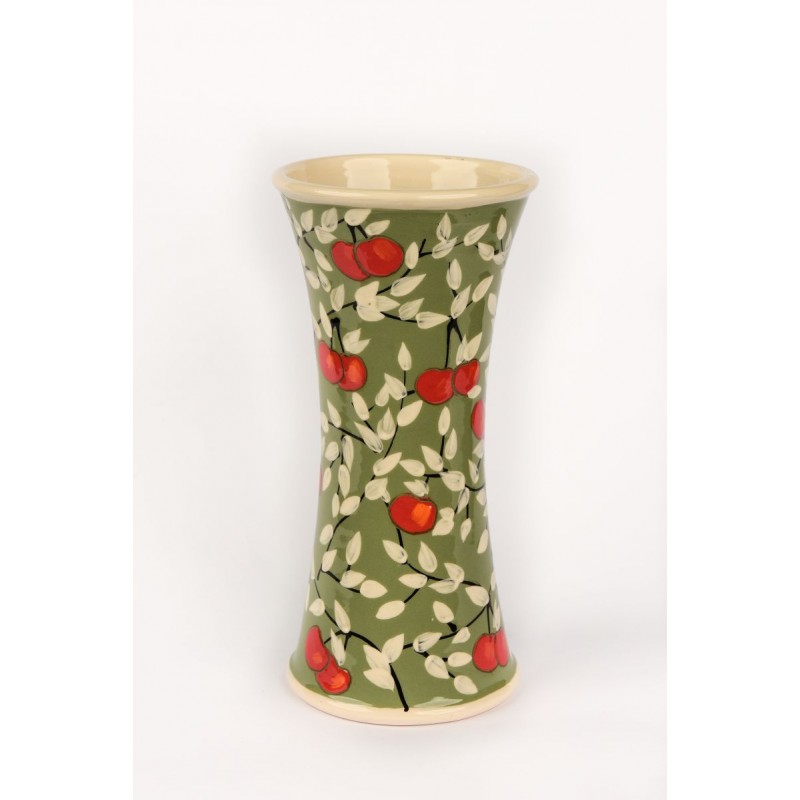 Vase - apples on a green background